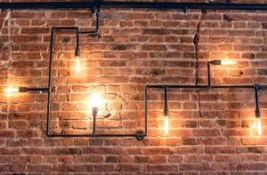 industrial light fixture on a brick wall