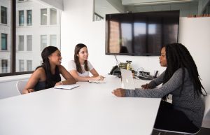 three women in an HR meeting